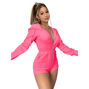 Detail view of hot pink velvet hooded jumpsuit with front zipper and elastic waist