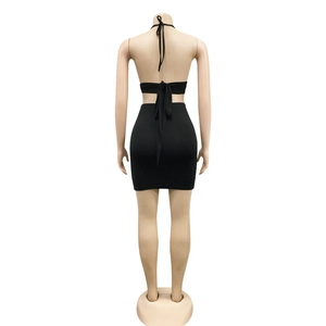 Detail of the back lacing and open back design on a black bodycon two-piece set