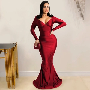 Detail of the elegant wine red V-neck satin evening gown with floor-length fishtail hem