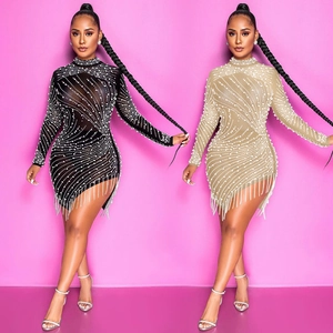 Detail view of mesh mini dresses featuring sparkling rhinestones and silver fringe hemline