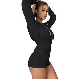 Close-up of black hooded sports romper with zipper closure and comfortable knit fabric