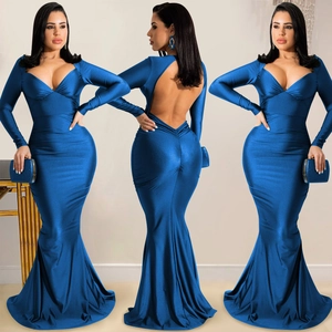 Detail view of royal blue backless mermaid evening gown with deep V-neck and sequins clutch