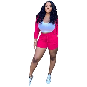 Detail view of pink three-piece set featuring hooded jacket, white tank top and drawstring shorts