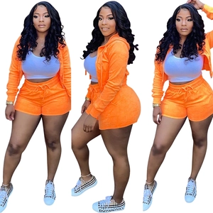 Three-view shot of women's orange velvet hoodie and drawstring shorts leisure set