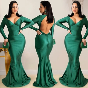 Three-way view of emerald green satin evening dress featuring a deep V-neck and open back