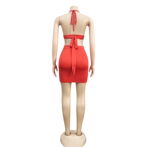 Detail showing the lace-up backless red two-piece dress set with criss-cross ties