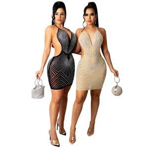 Detail of sexy V-neck mesh mini dress with sparkling rhinestones and waist cutouts
