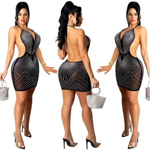 Detailed view of backless black mesh dress with silver rhinestones in geometric pattern