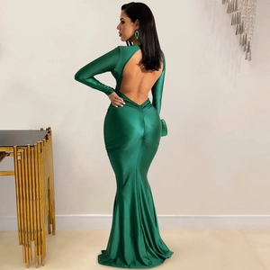 Detail view of emerald green backless maxi dress with silk-like shine and mermaid hem