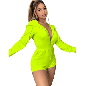 Detail view of neon yellow hooded romper with front zipper and velvet texture
