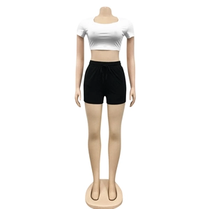Close-up of white cropped t-shirt and black drawstring shorts on female mannequin