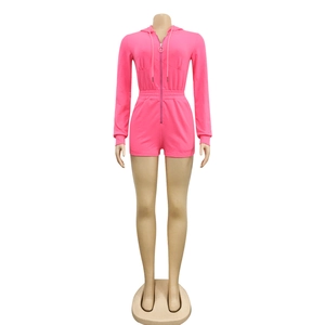Detail of hot pink athletic romper featuring front zipper closure and drawstring waist