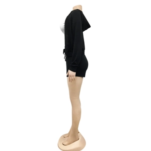 Close-up of black hooded zipper jacket and matching slim fit shorts on a mannequin