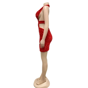 Detail of red sequined halter neck mini dress with side cut-out and open back