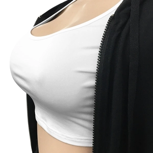 Detail of white ribbed crop top with black hooded zip-up sweatshirt on mannequin