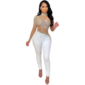 Women's glamorous white jumpsuit with sheer mesh, rhinestones, and one-shoulder sleeve