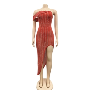Detail of red one-shoulder evening dress with silver rhinestones and asymmetrical high slit