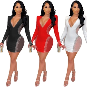 Detail of sexy V-neck bodycon dress with rhinestone embellishments and sheer mesh panels