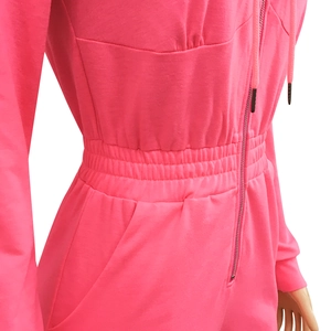 Detail view of pink hooded jumpsuit with drawstring waist and zip-up design