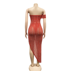 Rear view of red mesh evening dress featuring sparkling rhinestones and asymmetric hem