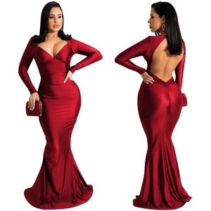 Detail view of deep red satin evening gown featuring an open back and mermaid silhouette