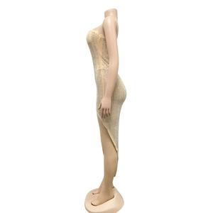 Detail view of skin-colored dress with silver rhinestones and high side slit