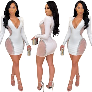 Detailed side and back view of white deep V-neck dress with mesh and silver rhinestones