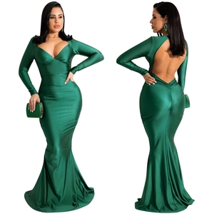 Detail of dark green satin mermaid evening gown with deep V-neck and open back design