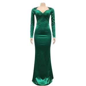 Detail of elegant emerald green V-neck evening dress with velvet mermaid silhouette