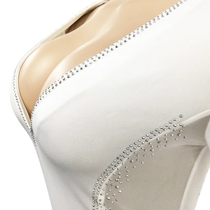 Close-up of deep V-neckline with sparkling silver rhinestones and sheer mesh patchwork
