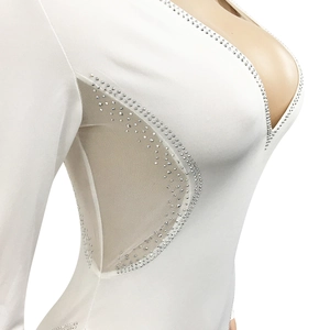 Detail of white deep V-neck bodycon dress with silver rhinestones and side mesh panels