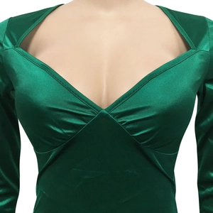 Detail of dark green satin dress featuring V-neckline with symmetric cutout and pleating