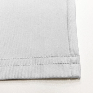 Detail of double-needle stitching and high-quality knitted fabric on white bodysuit
