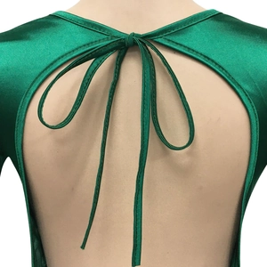 Detailed view of the backless green satin dress featuring an elegant bow tie fastener