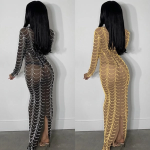 Detailed view of sheer mesh dress featuring sparkling rhinestones and pearl scalloped patterns