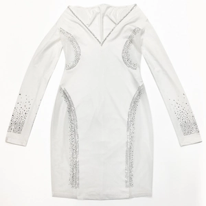 Detail of white long sleeve dress with V-neck and sparkling rhinestone embellishments