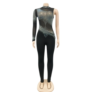Detail of sheer black mesh stitching with sparkling rhinestones on long sleeve jumpsuit