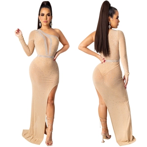 Close-up of nude one-shoulder dress with silver rhinestones and sheer mesh cutout