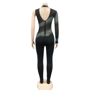 Detail of sheer black bodysuit with rhinestone pattern and deep V-back design