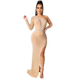 Detail of nude evening dress featuring shimmering rhinestones and asymmetric one-shoulder design