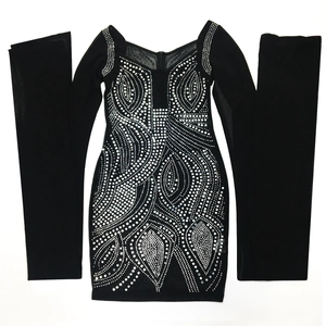 Detail of silver rhinestones and geometric patterns on black mesh evening dress