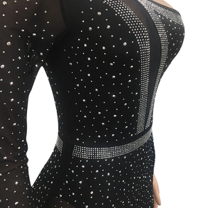Detailed macro view of black mesh bodycon dress featuring shimmering silver rhinestones