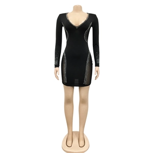 Detail of shimmering rhinestones on black long sleeve deep V-neck bodycon party dress