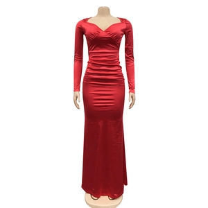 Close-up of elegant V-neck red satin dress with long sleeves and gathered waist detail