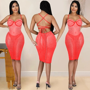 Detailed view of red bodycon dress featuring rhinestone embellishments and open back straps