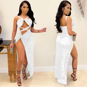 Detail of white mesh maxi dress with sparkling rhinestones, side slit and cutout neck