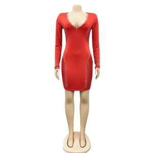 Detail of red long sleeve bodycon dress with deep V-neck and sparkling rhinestone patterns