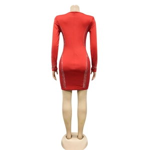 Detail of red bodycon mini dress showing rhinestone accents and slim fit from back view
