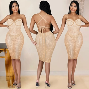Detail view of backless rhinestone dress with crisscross straps and rear hidden zipper