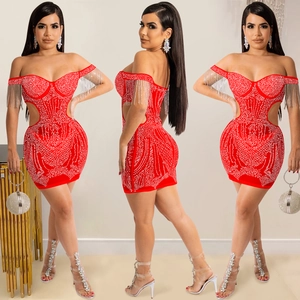Detail of red off-shoulder mini dress with shimmering rhinestones and tassel fringe